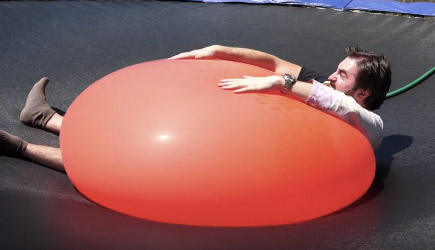 The Slow Mo Guys - Crushed By A Giant 6ft Water Balloon