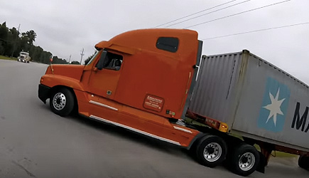 Trucker Rolls Stop Sign